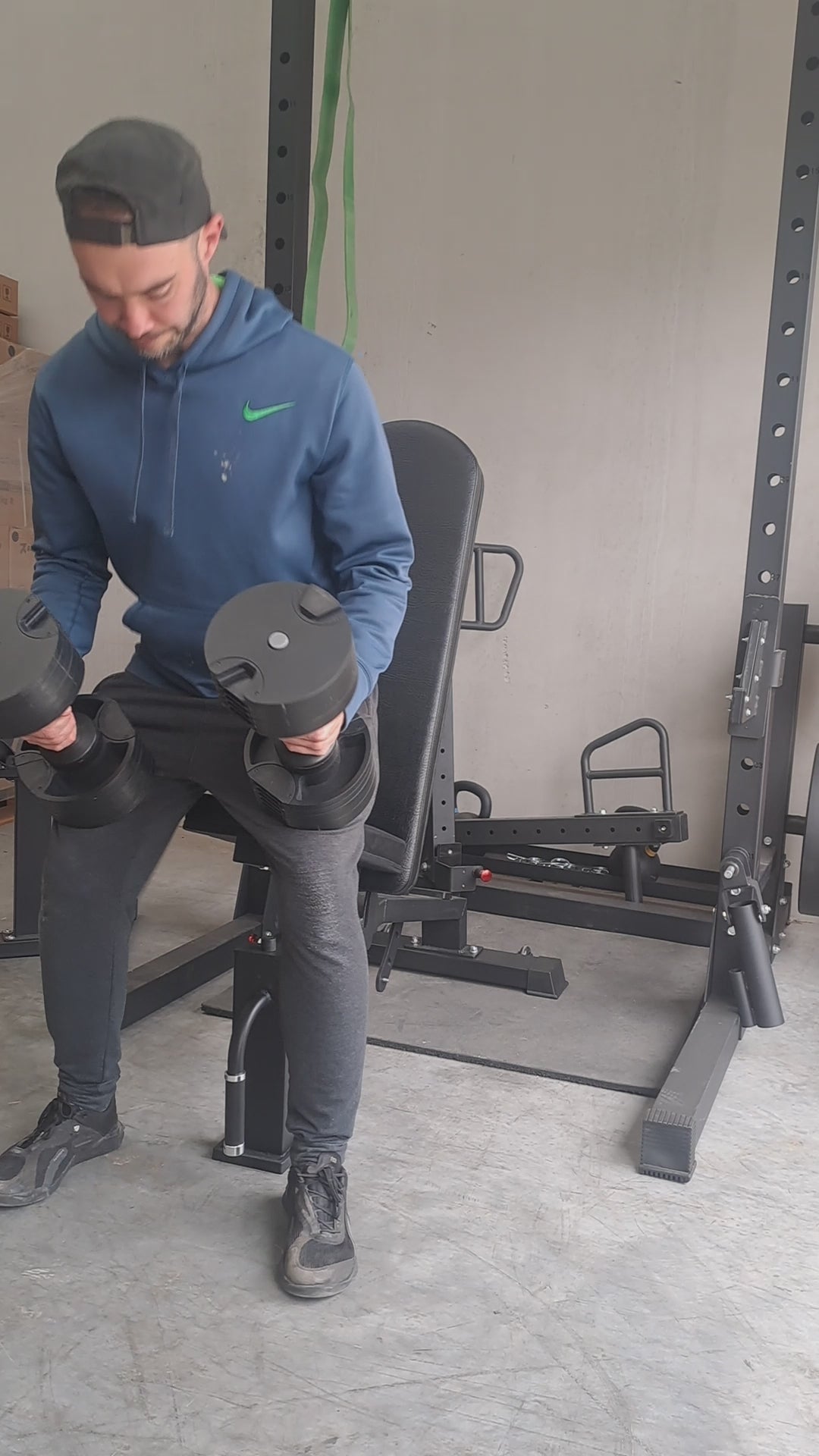 Adjustable Bench and Adjustable Dummbells working out in home gym doing presses